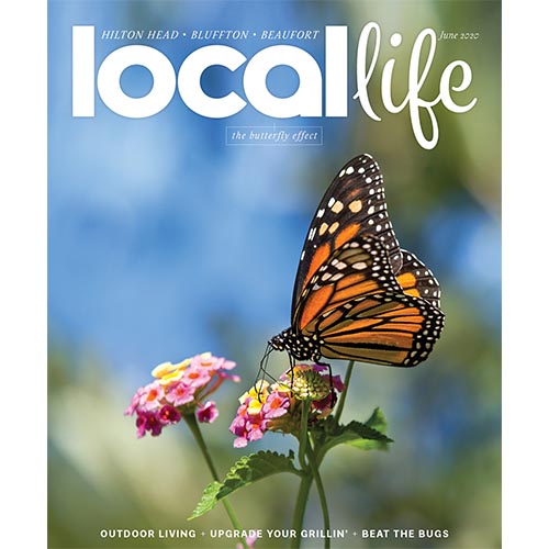 Magazine cover of Local Life with butterfly perched on pink flower.