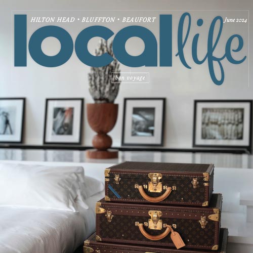 Local Life magazine cover with vintage chest and framed artwork on wall.