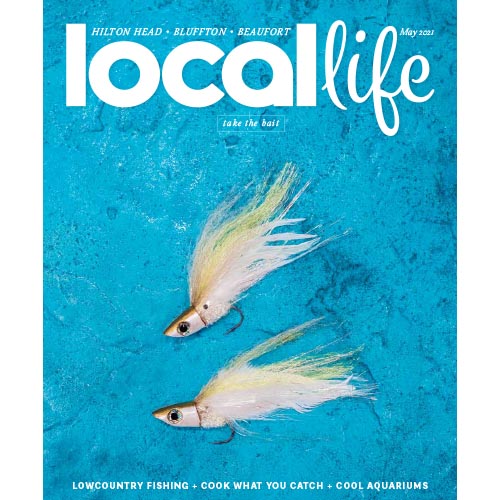 Magazine cover of Local Life with two swimming fishing bait.