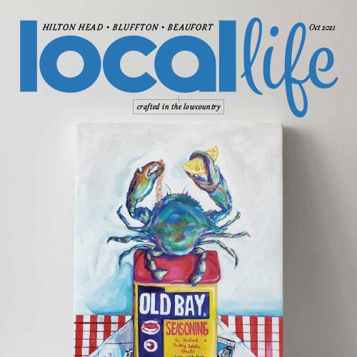 Local Life magazine cover featuring Old Bay seasoning and a blue crab.