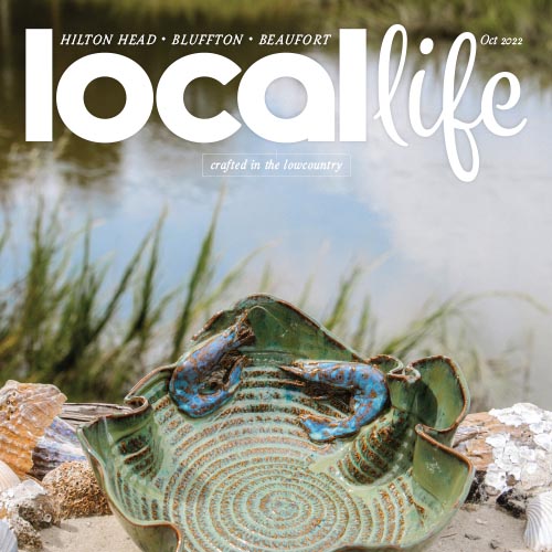 Local Life magazine cover featuring turtle on beach with shell art.