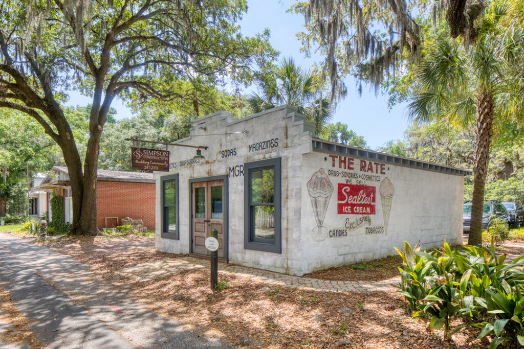 Side view of small brick building with sign reading "The Bluff."